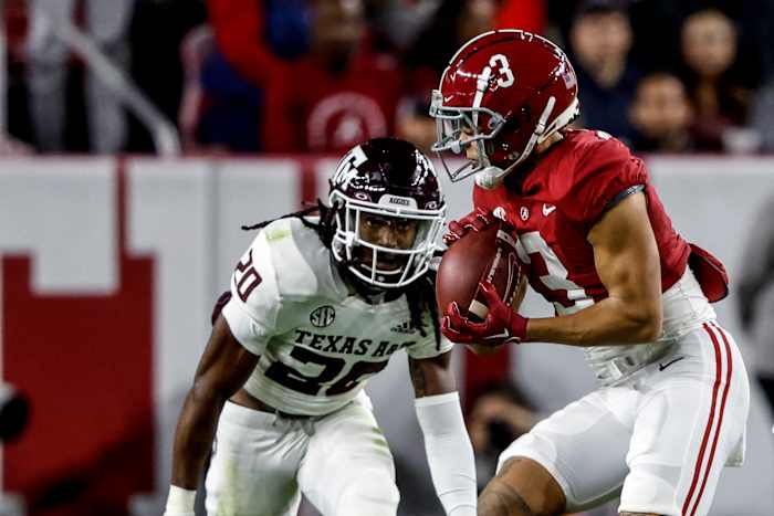 Texas A&M Aggies defensive back Jardin Gilbert (No. 20) makes an open-field tackle against Alabama receiver Jermain Burton (No. 3) in a 24-20 loss at Bryant-Denny Stadium in Tuscaloosa, Ala.
